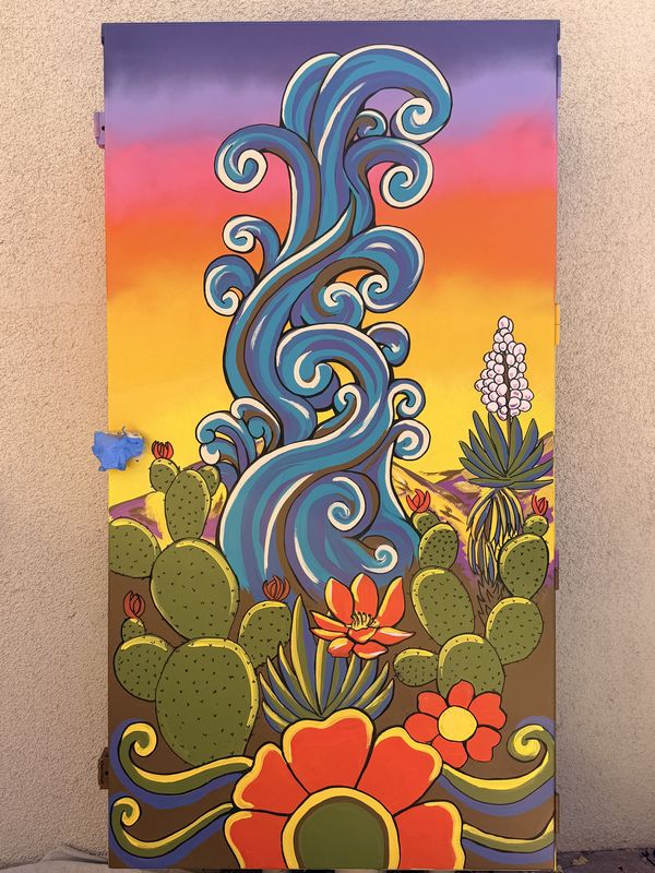 Side panel of Andy Carlson's City of Henderson utility box mural: swirling blue water rising into a purple, pink and orange sunset over prickly pear cactus, a blooming yucca and big red desert flowers